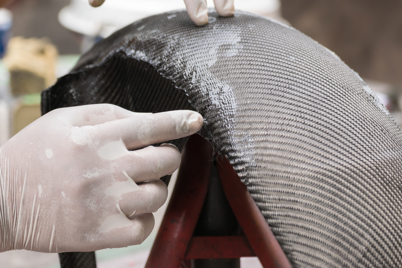 Wrapping carbon fiber or kevlar and man hand for working